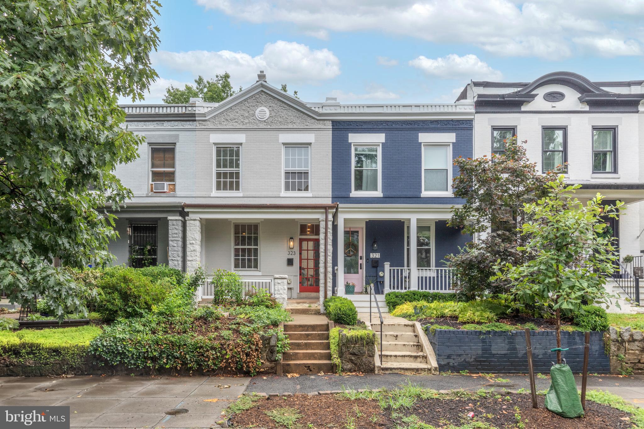 323 14th Street Northeast Washington, DC 20002 - Photo 2 of 41 a front view of a house with porch and garden