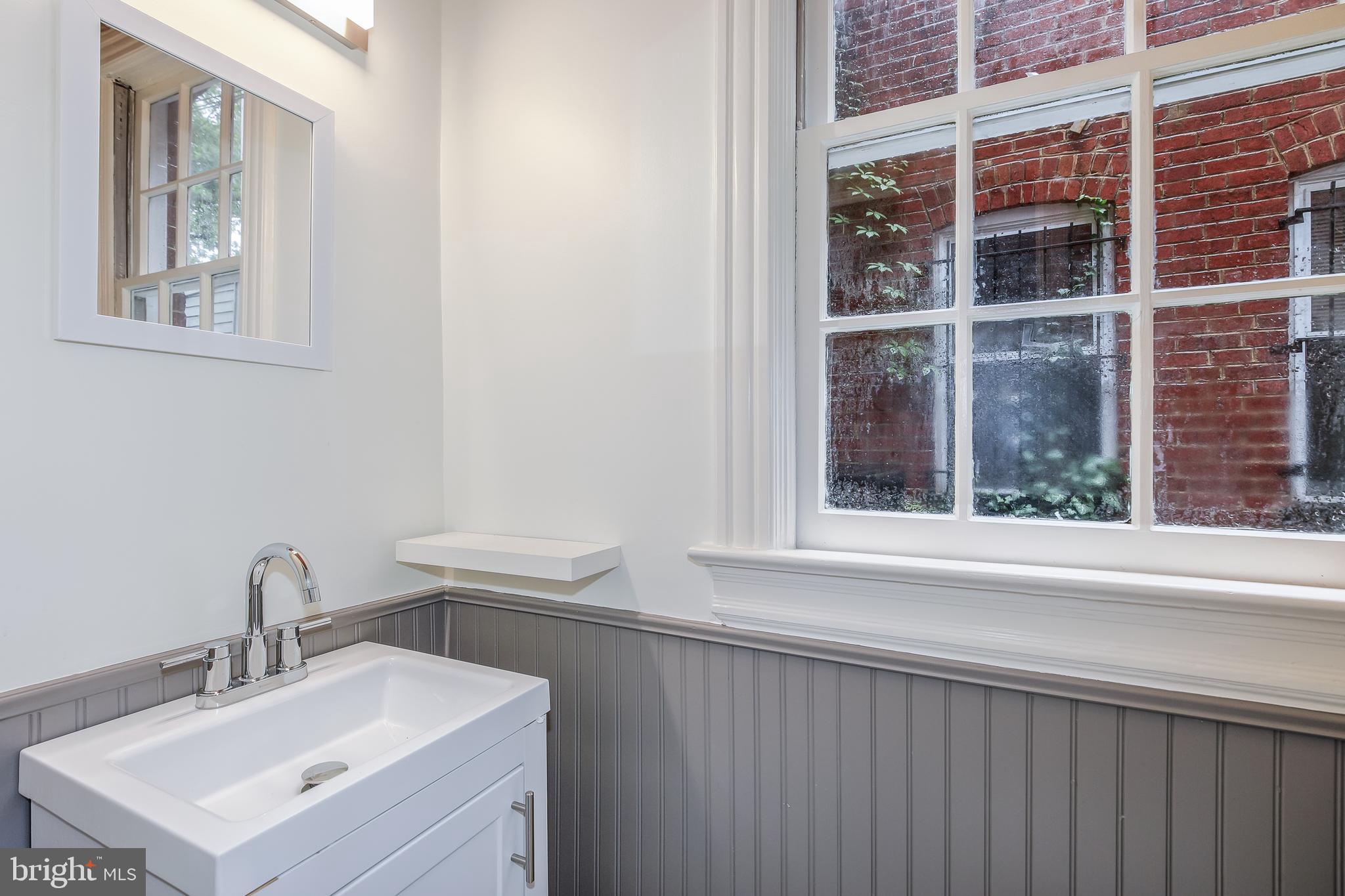323 14th Street Northeast Washington, DC 20002 - Photo 22 of 41 a bathroom with a sink and a window