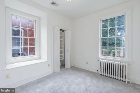 an empty room with windows