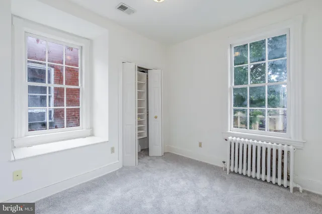 an empty room with windows