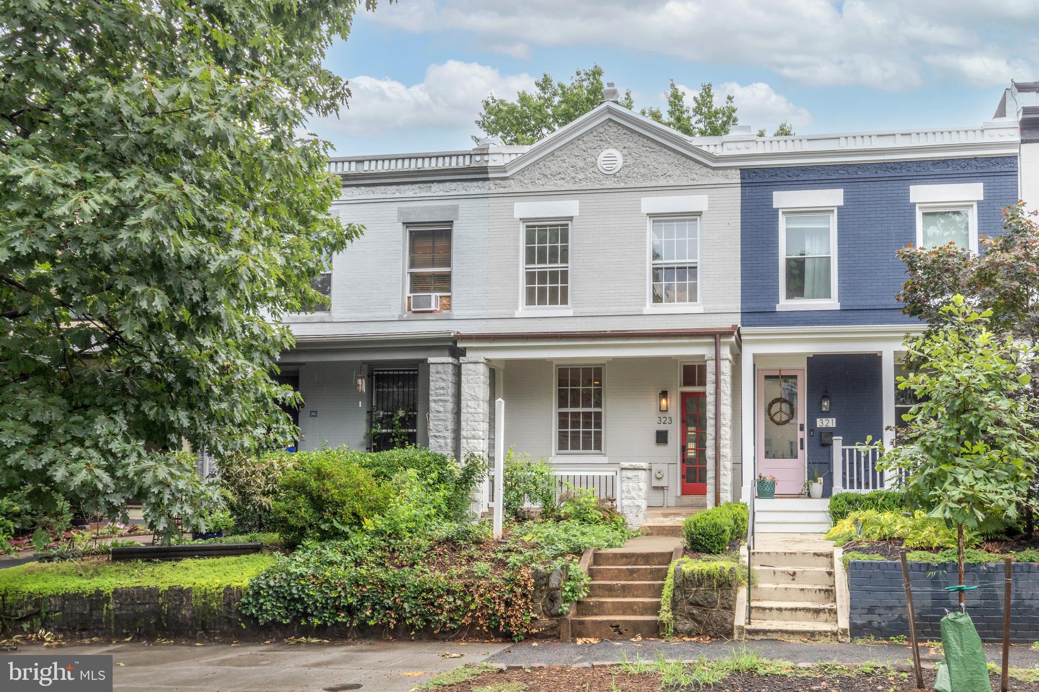 323 14th Street Northeast Washington, DC 20002 - Photo 3 of 41 a front view of a house with a yard