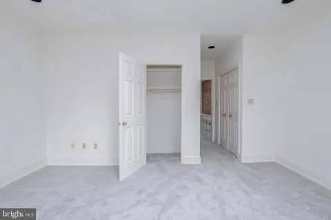 a bathroom with a toilet a sink a mirror a bathtub and shower