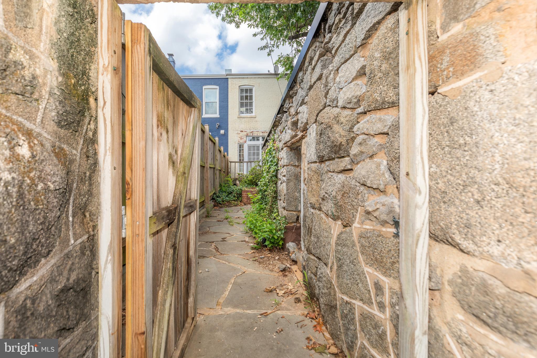 323 14th Street Northeast Washington, DC 20002 - Photo 40 of 41 a view of a pathway of a house with backyard