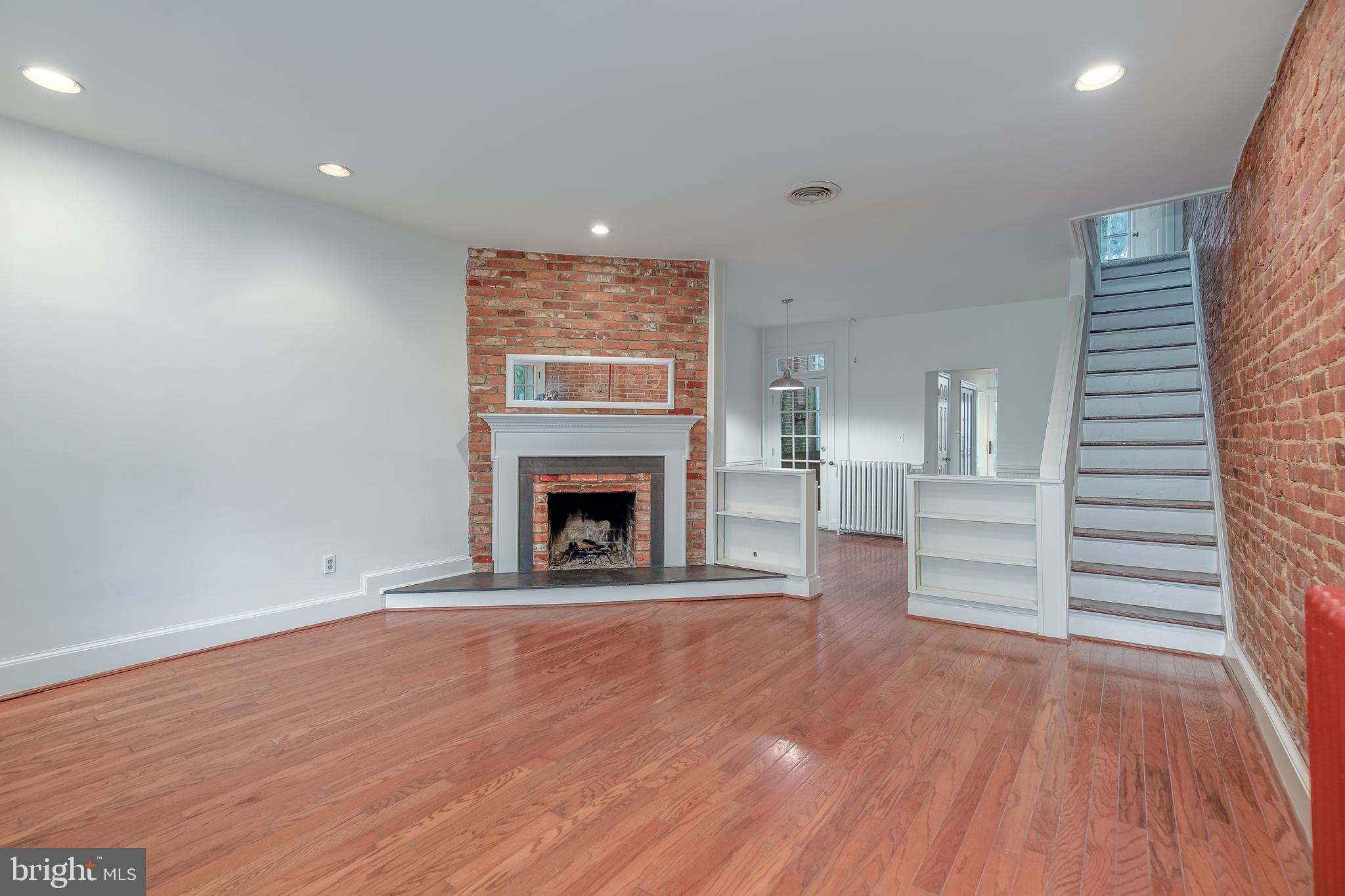323 14th Street Northeast Washington, DC 20002 - Photo 7 of 41 a view of empty room with wooden floor and fireplace