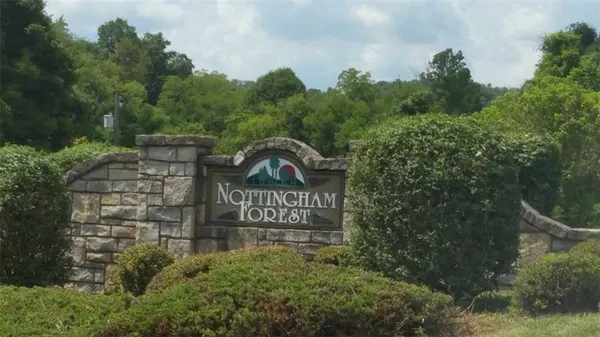 a view of outdoor space with signage and flags