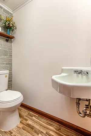 a bathroom with a toilet and a sink