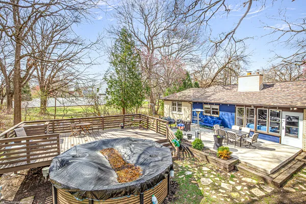 a view of a patio with swimming pool table and chairs
