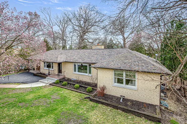 a backyard of a house with yard barbeque oven and outdoor seating