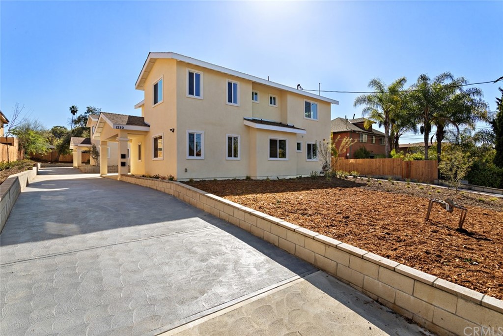 1282 North Summit Avenue Pasadena, CA 91103 - Photo 1 of 40 a front view of a house with a yard