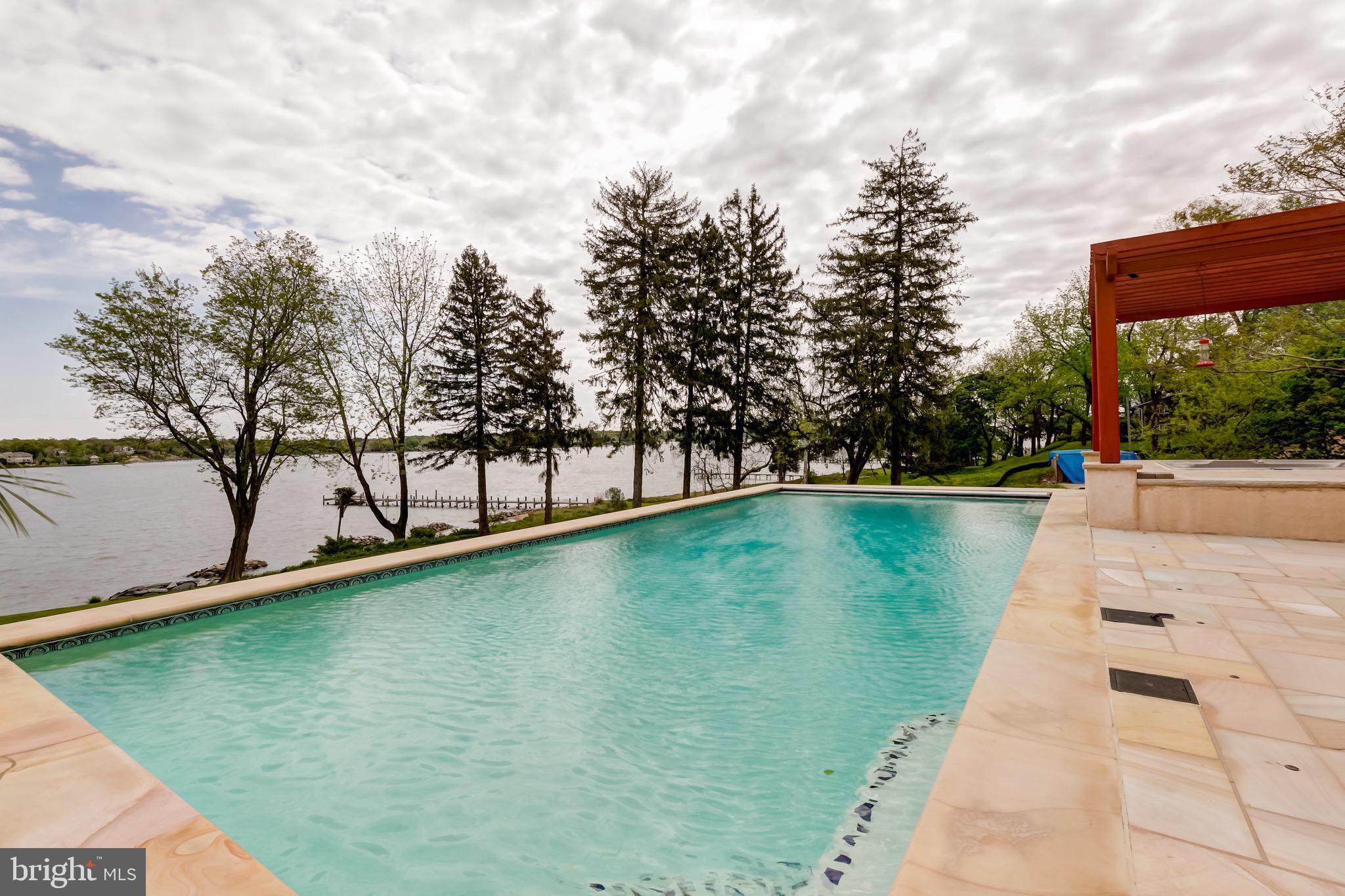 833 Londontown Road Edgewater, MD 21037 - Photo 66 of 100 Premium Stone Work, Honed Edges Around Pool