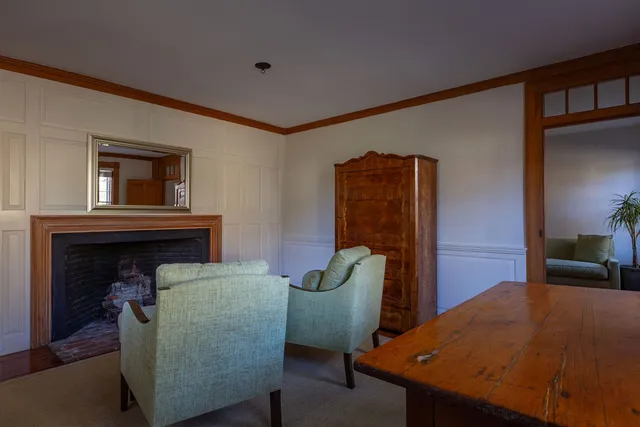 a bedroom with a bed and a potted plant