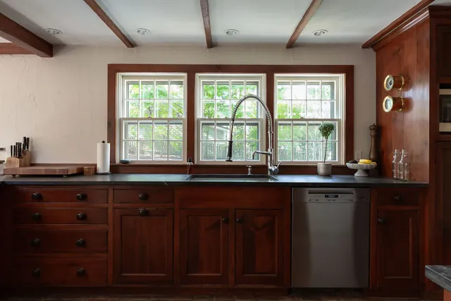 a view of a livingroom with furniture and a window