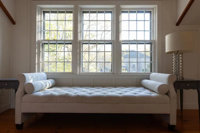 a bedroom with a large bed and a window