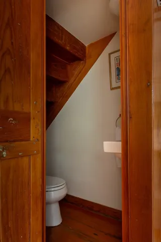 a bathroom with a toilet and a shower