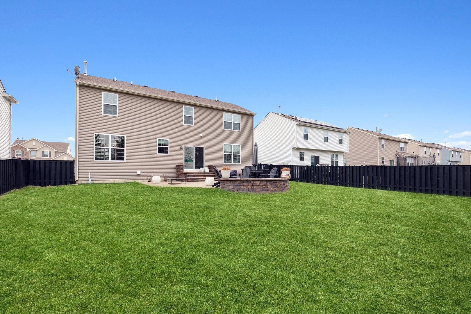 151 Reston Lane Gilberts, IL 60136 - Photo 19 of 19 a view of a backyard with plants and wooden fence