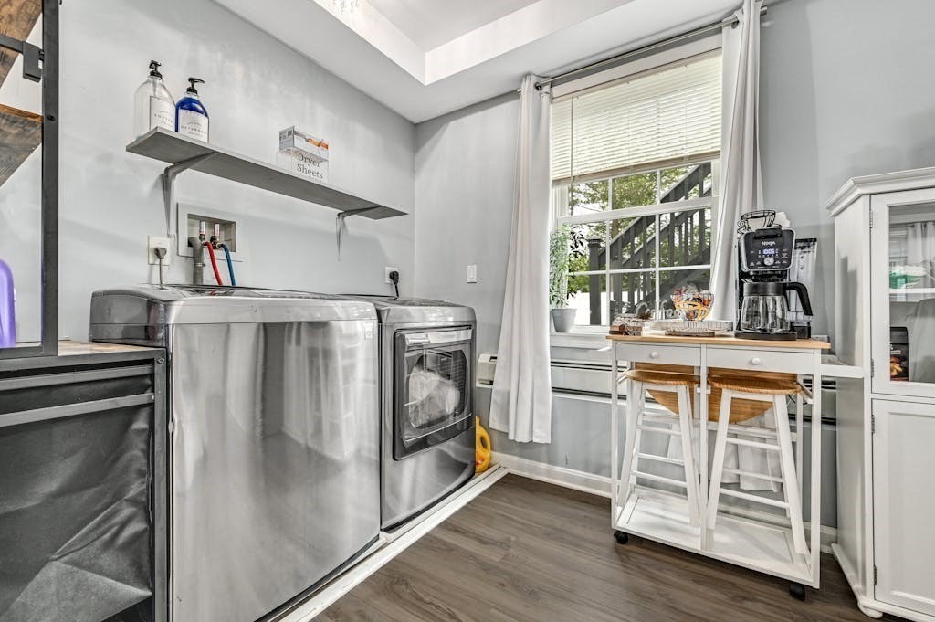 15 Jackson Road Webster, MA 01570 - Photo 11 of 31 a kitchen with stainless steel appliances a stove and a refrigerator
