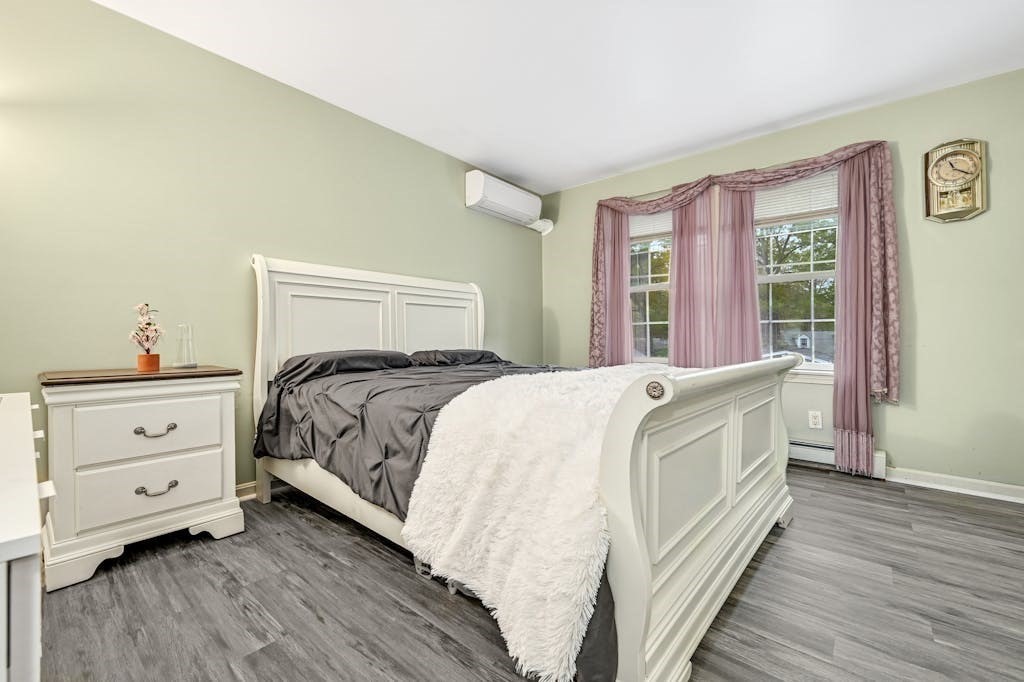 15 Jackson Road Webster, MA 01570 - Photo 22 of 31 a bed room with a bed and a window