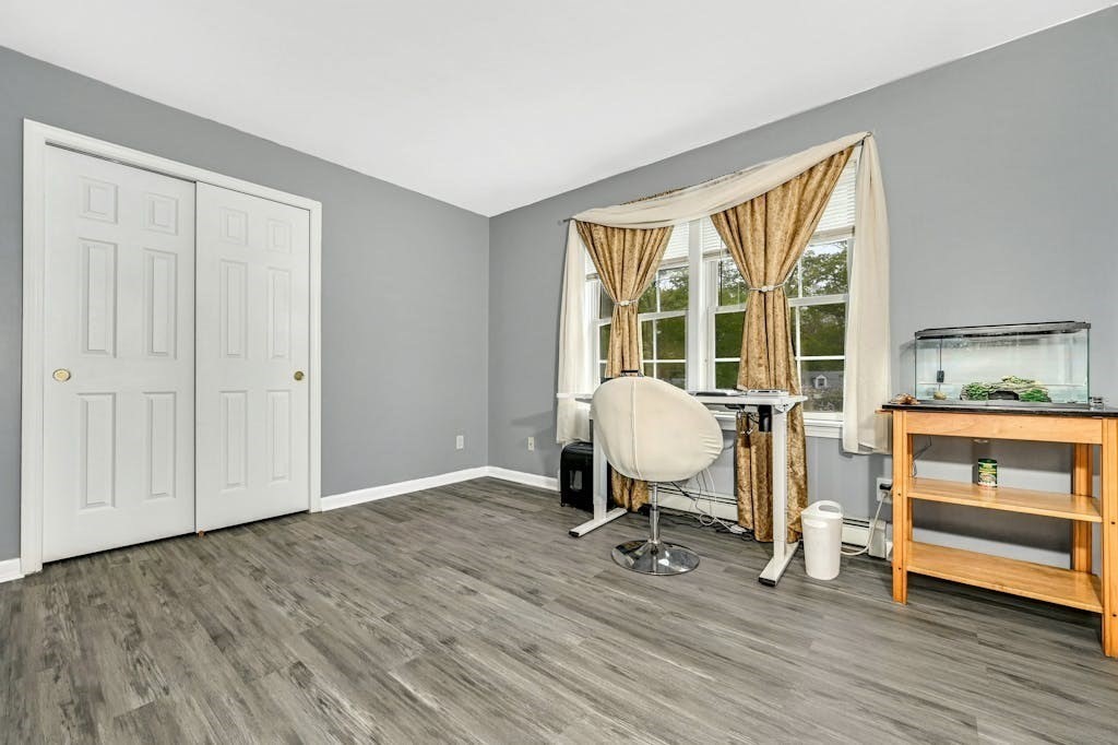 15 Jackson Road Webster, MA 01570 - Photo 23 of 31 a view of a workspace with wooden floor and furniture