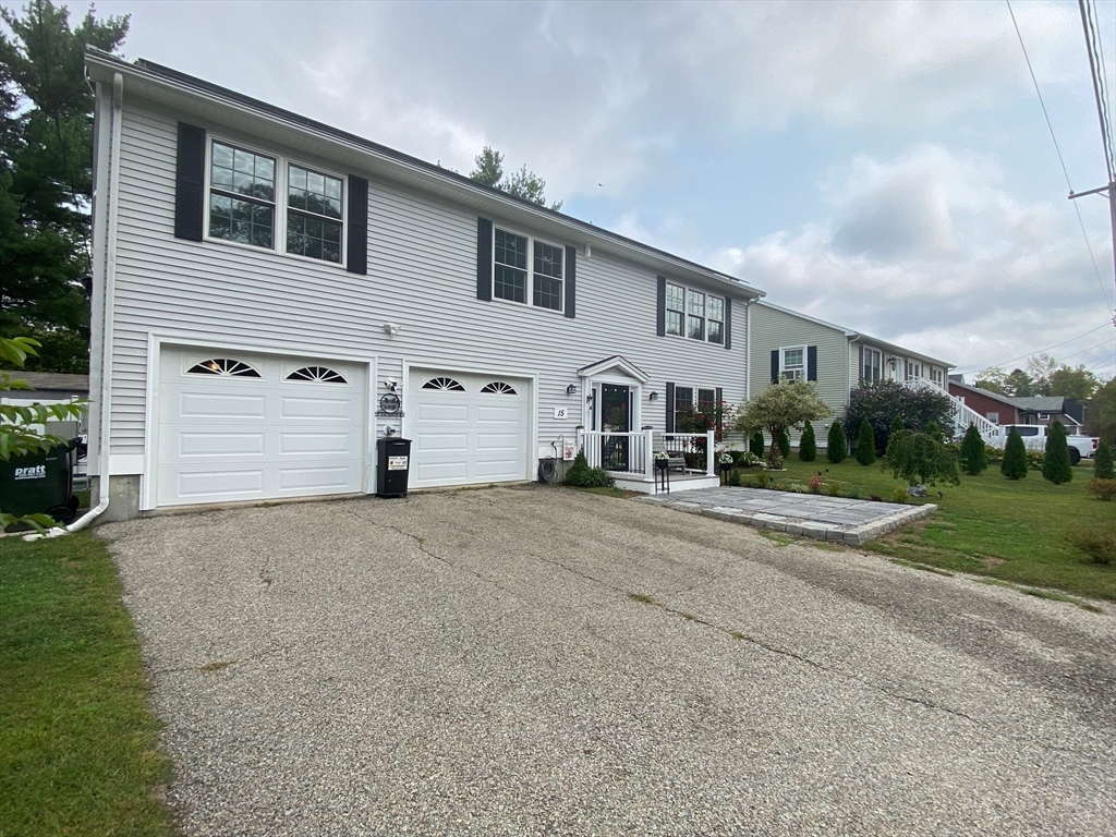 15 Jackson Road Webster, MA 01570 - Photo 29 of 31 a view of a white house with a yard and garage