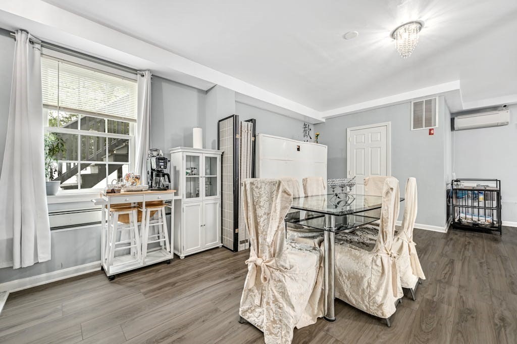 15 Jackson Road Webster, MA 01570 - Photo 9 of 31 a kitchen with stainless steel appliances a dining table chairs and wooden floor