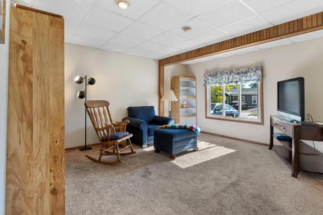 a view of a dining room with furniture and a flat screen tv