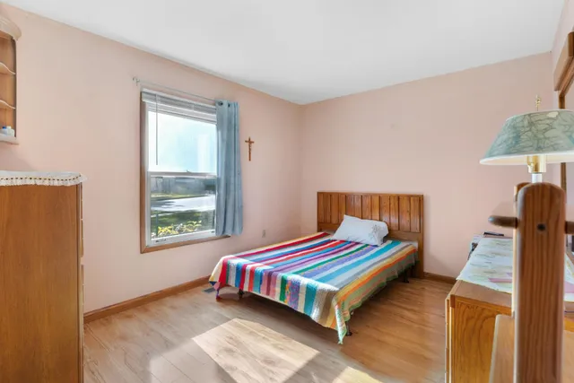 a bedroom with a bed and a dresser