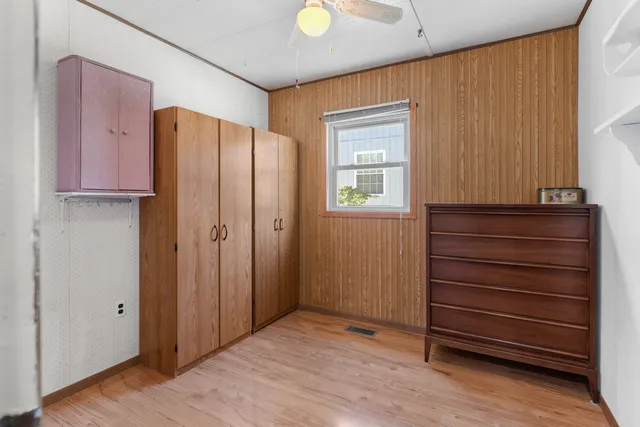 a view of a bathroom with wooden floor