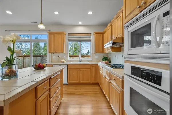 a kitchen with a table and chairs in it
