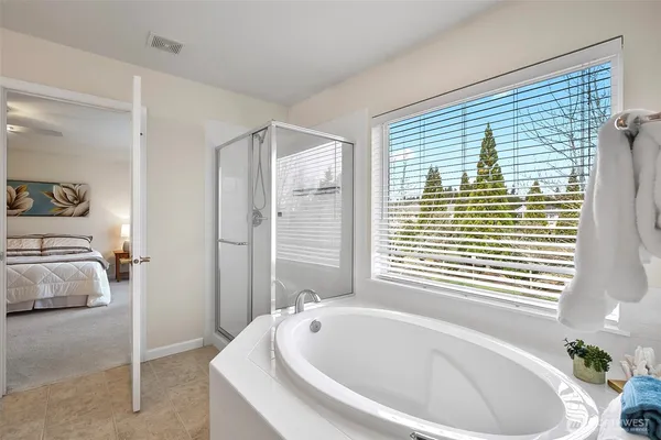 a living room with furniture a window and a table