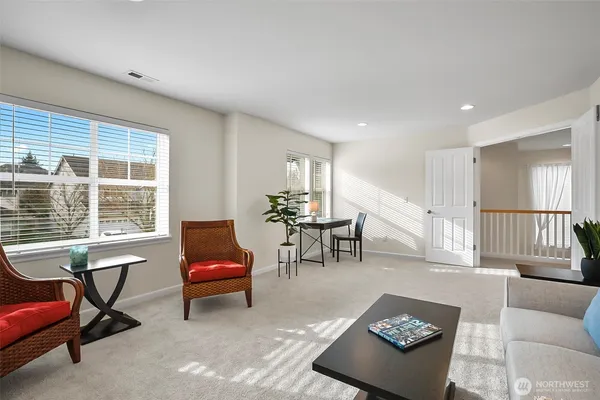 a bedroom with furniture and a wooden floor