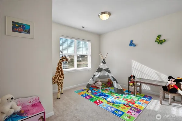 a bathroom with a granite countertop sink a toilet and a mirror