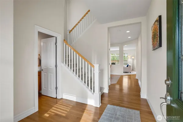 a view of a dining room with furniture wooden floor and a chandelier