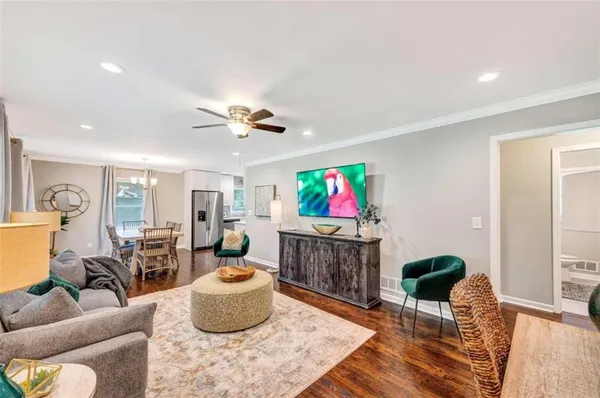 a living room with furniture and a flat screen tv