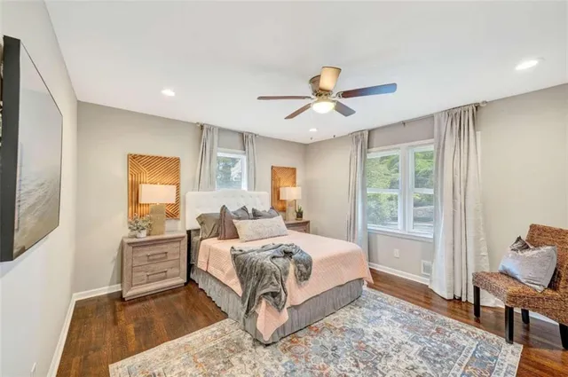 a bedroom with a large bed and a window