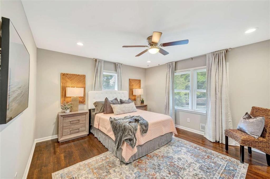 1376 Sandtown Road Southwest Marietta, GA 30008 - Photo 15 of 25 a bedroom with a large bed and a window