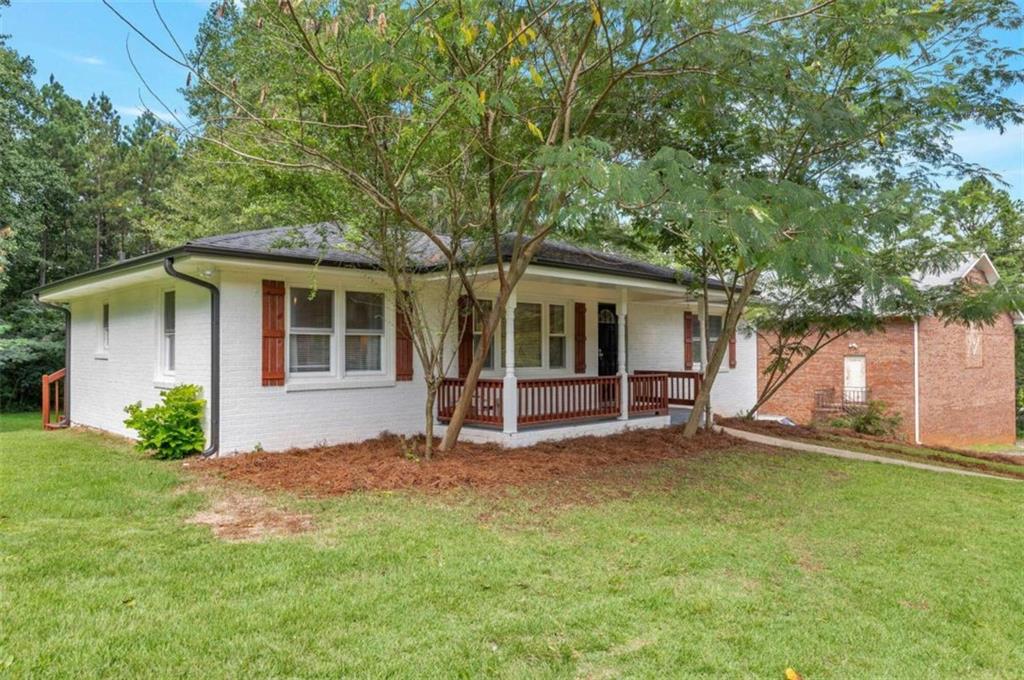 1376 Sandtown Road Southwest Marietta, GA 30008 - Photo 24 of 25 front view of a house with a yard