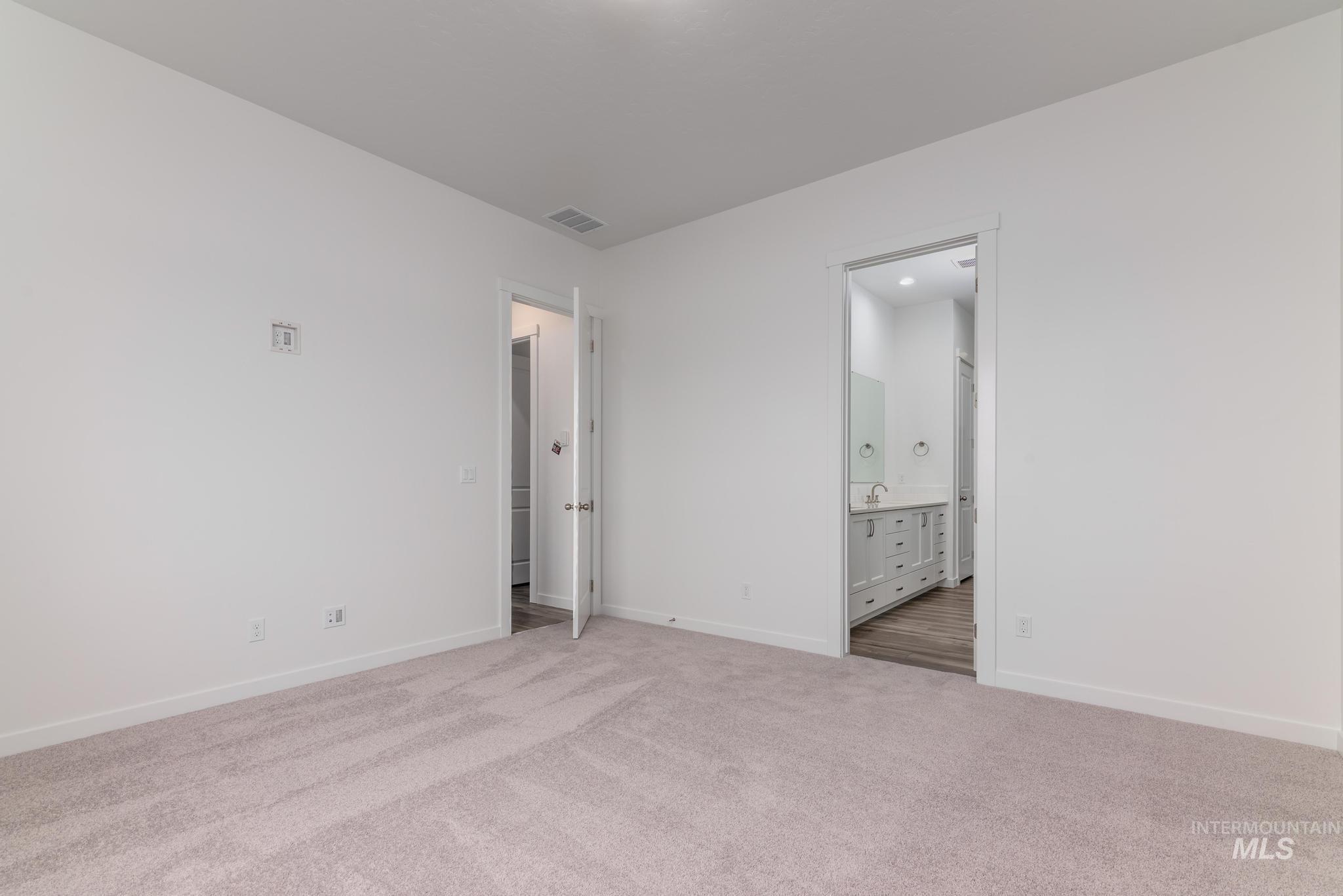 15232 Steel Cloud Avenue Caldwell, ID 83607 - Photo 17 of 33 Unfurnished bedroom with carpet and ensuite bath