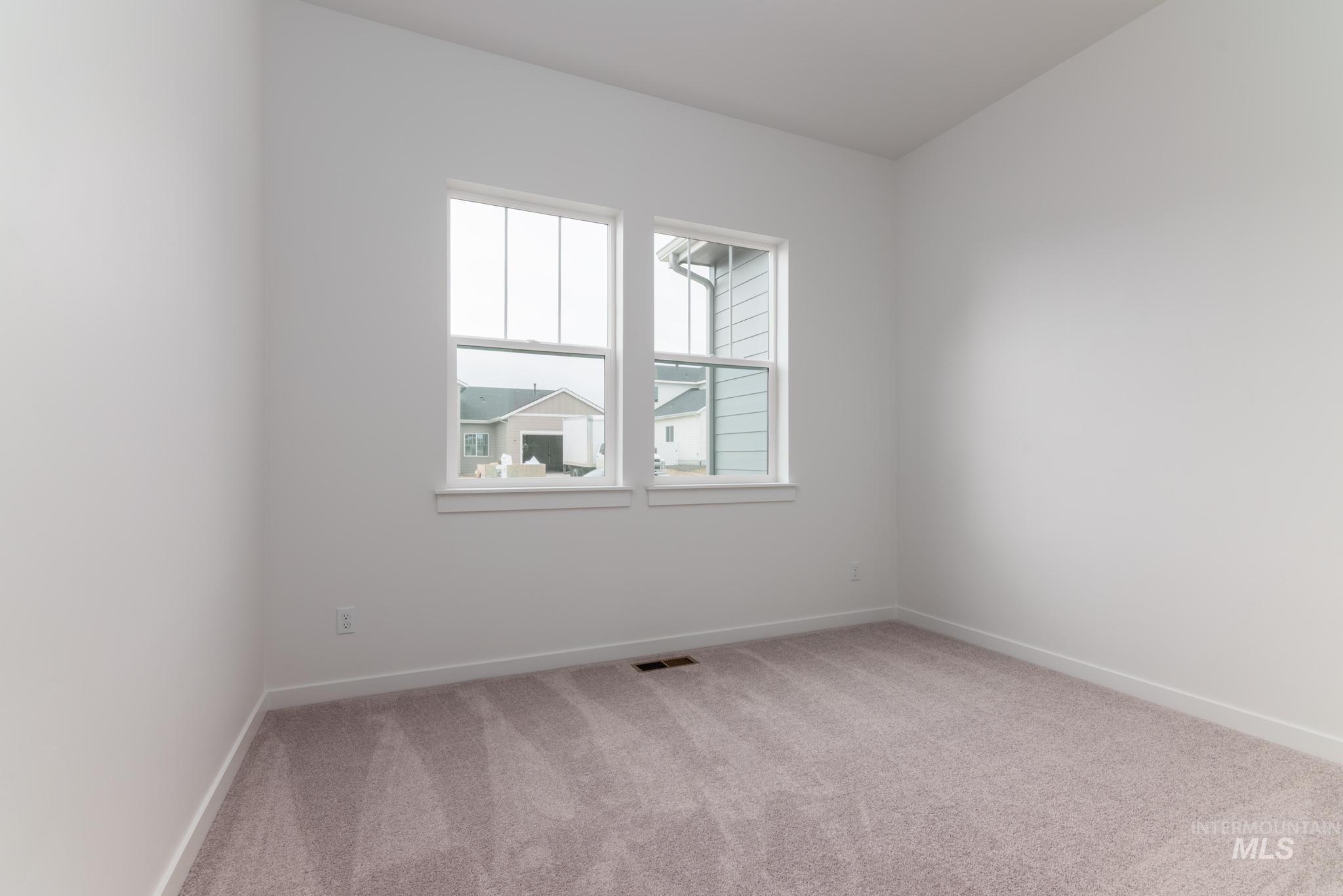 15232 Steel Cloud Avenue Caldwell, ID 83607 - Photo 21 of 33 Unfurnished room featuring light colored carpet and baseboards
