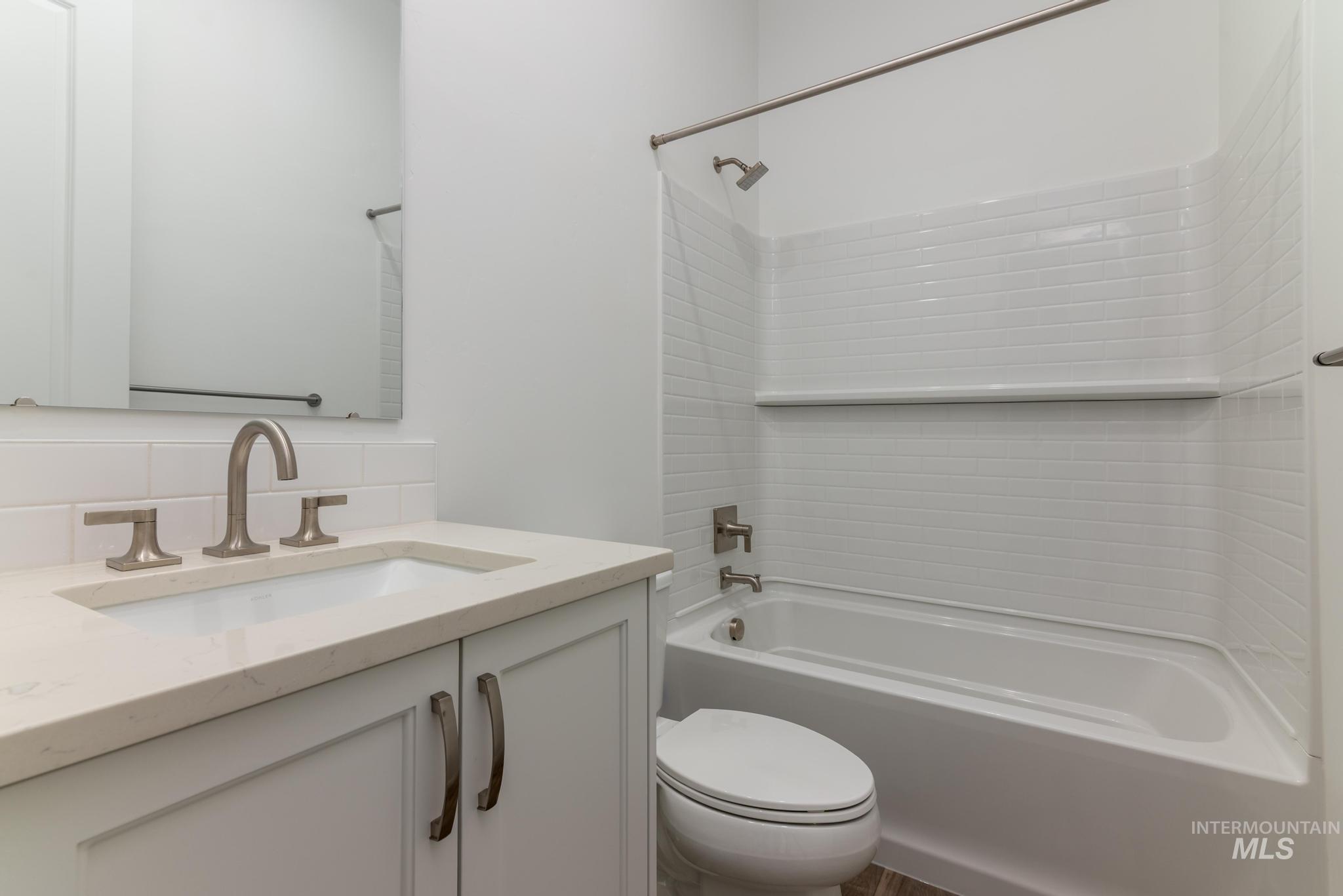 15232 Steel Cloud Avenue Caldwell, ID 83607 - Photo 22 of 33 Full bath with vanity, tub / shower combination, and backsplash