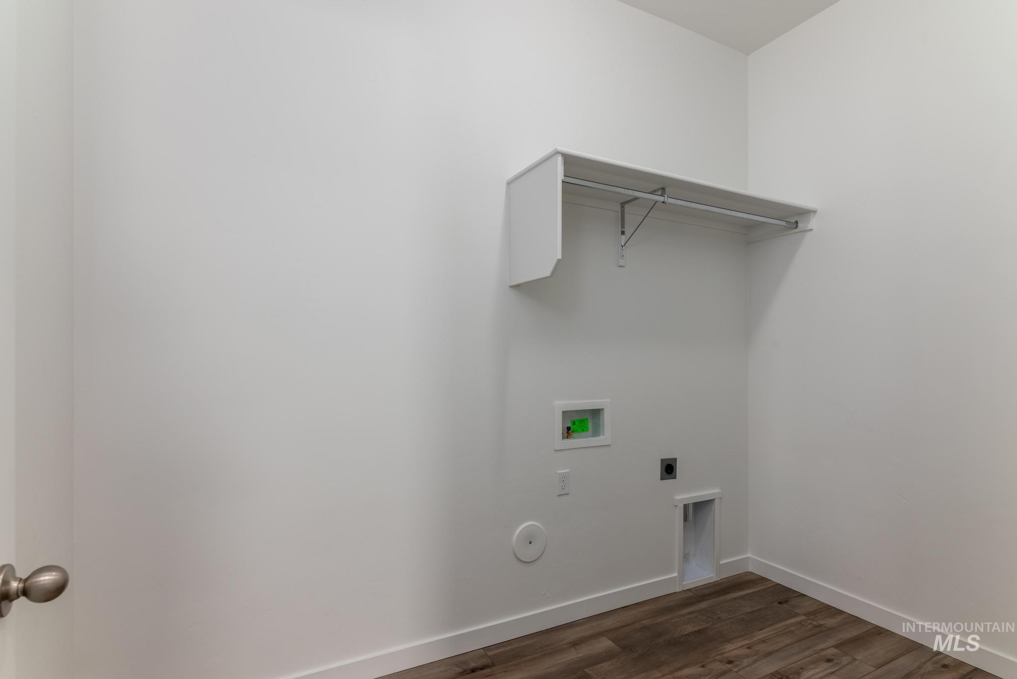 15232 Steel Cloud Avenue Caldwell, ID 83607 - Photo 26 of 33 Laundry area featuring hookup for an electric dryer, washer hookup, and dark wood-style flooring