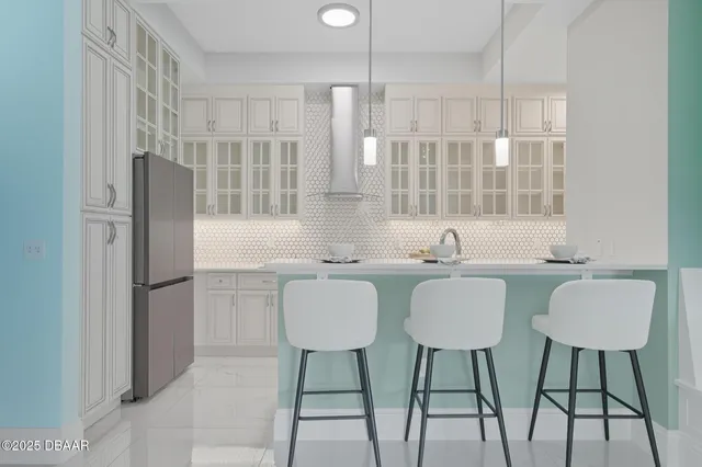 a kitchen with a sink and refrigerator