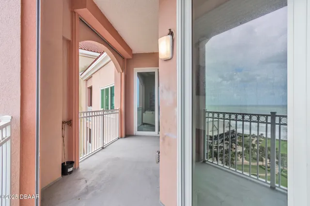 a bedroom with a bed and a lamp