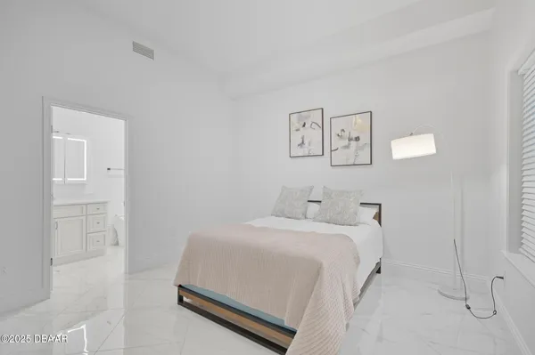 a room with a bed and hallway