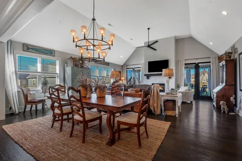 a living room with lots of furniture and a chandelier