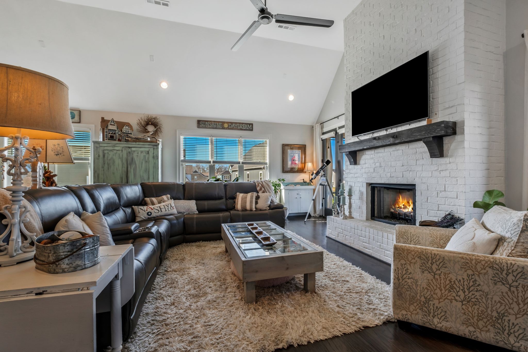 300 Croft Way Mount Juliet, TN 37122 - Photo 19 of 70 a living room with furniture a flat screen tv and a fireplace
