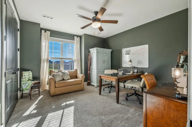 a view of living room with furniture and floor to ceiling window