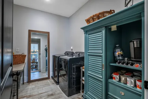 a bedroom with a bed and a table