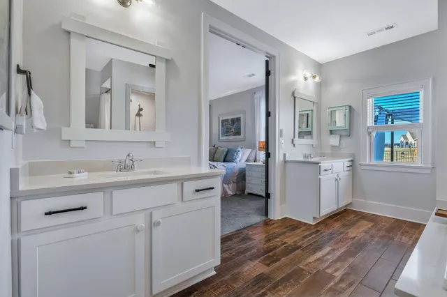 a view of two chairs in the patio