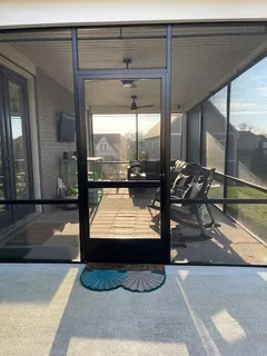 a bed room with a bed and a painting on the wall