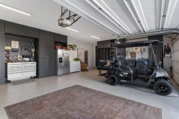 a living room with furniture and two windows